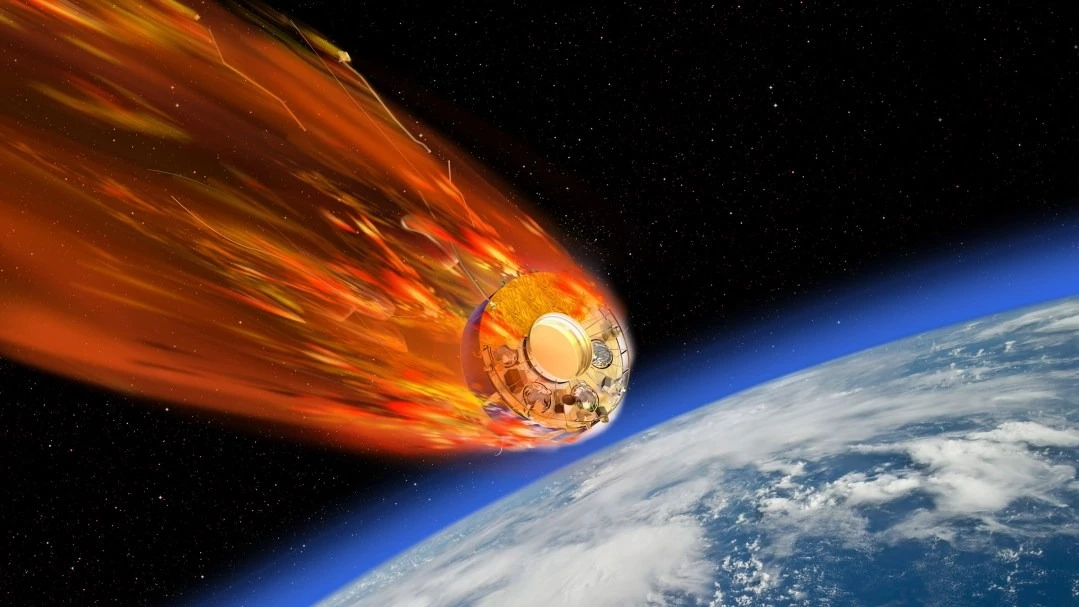 Umělecký koncept satelitu vstupující do atmosféry Země